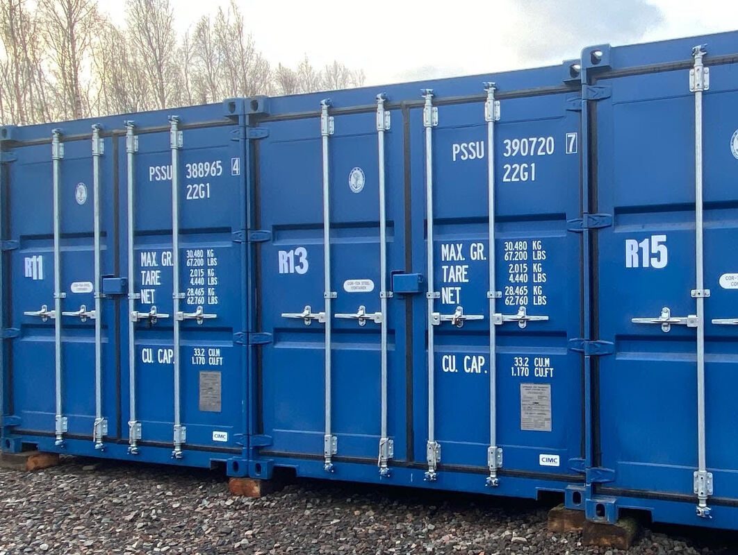 three shipping containers used as self storage units
