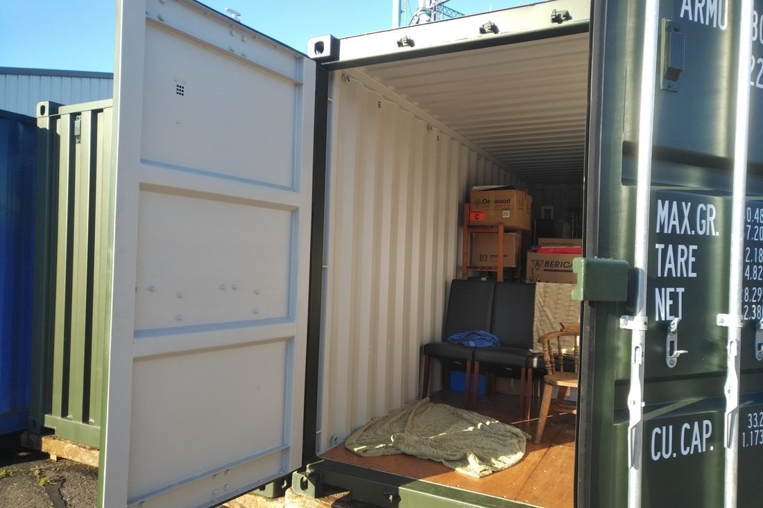 a car with boot wide open at a storage facility