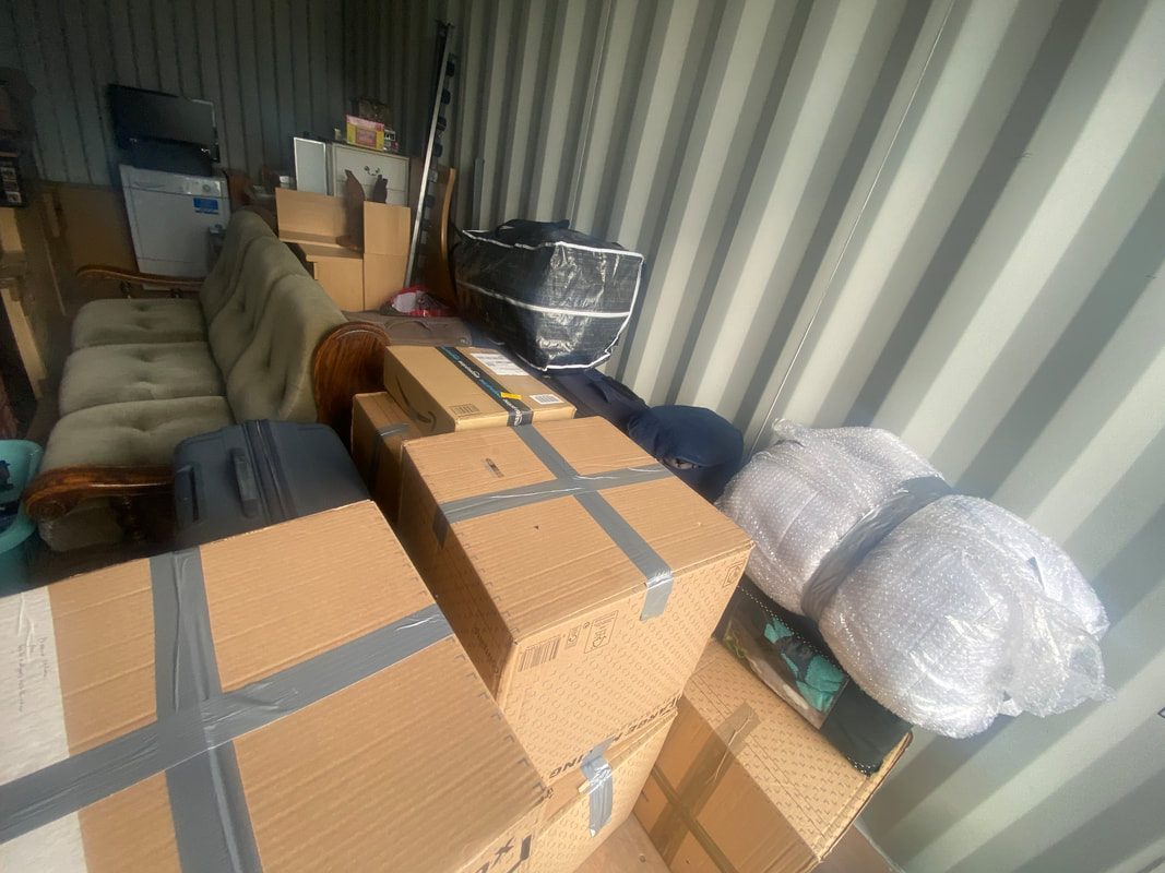 boxes and furniture inside a storage unit